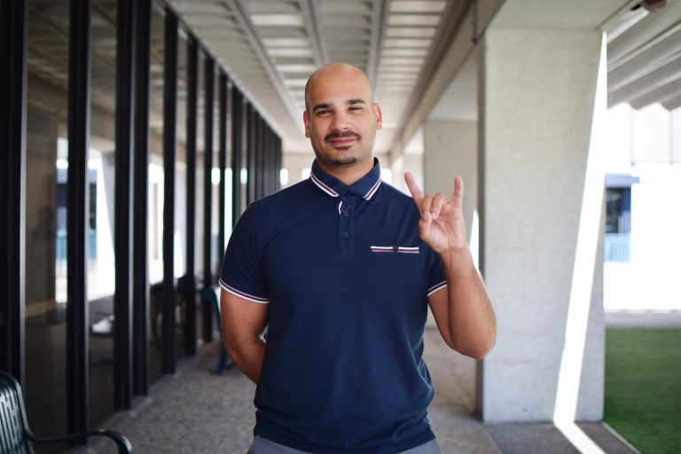 Jordan Knul holding the Hook 'em, Horns hand signal